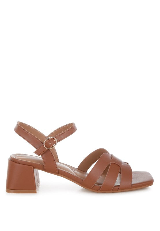 Side view of tan Eliska Strappy Block Heels with wide strap and ankle buckle.