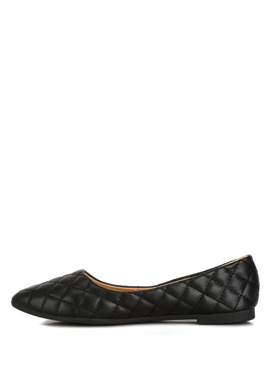 Side view of black quilted ballet flats with slip-on design.