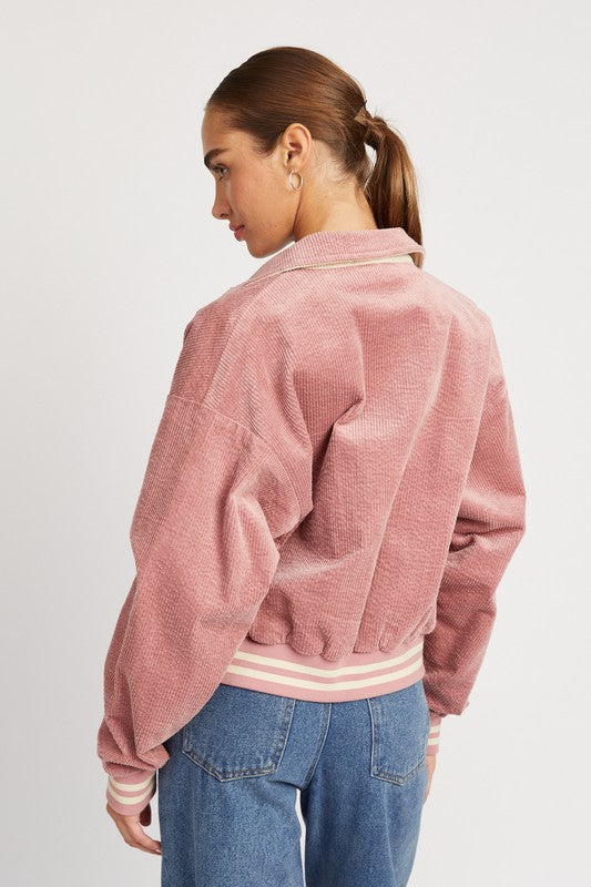 Rose pink Zita Bomber Jacket with white accents, snap buttons, and a cozy collar, offering a lightweight, feminine style for casual outfits.