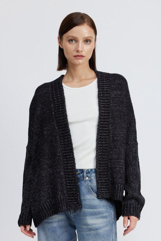 Model wearing Elistina Oversized Cardigan in charcoal, open front style.
