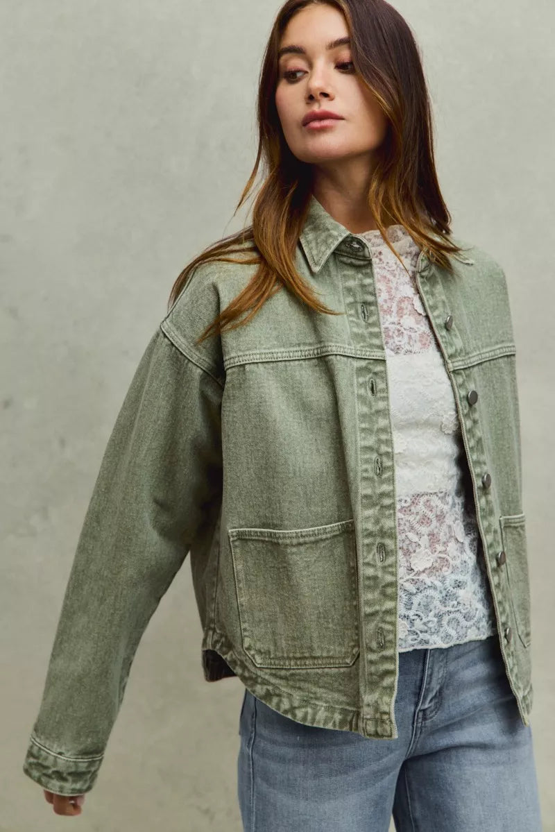 model adjusting Soren Vintage Twill Shacket showing easy oversized fit.