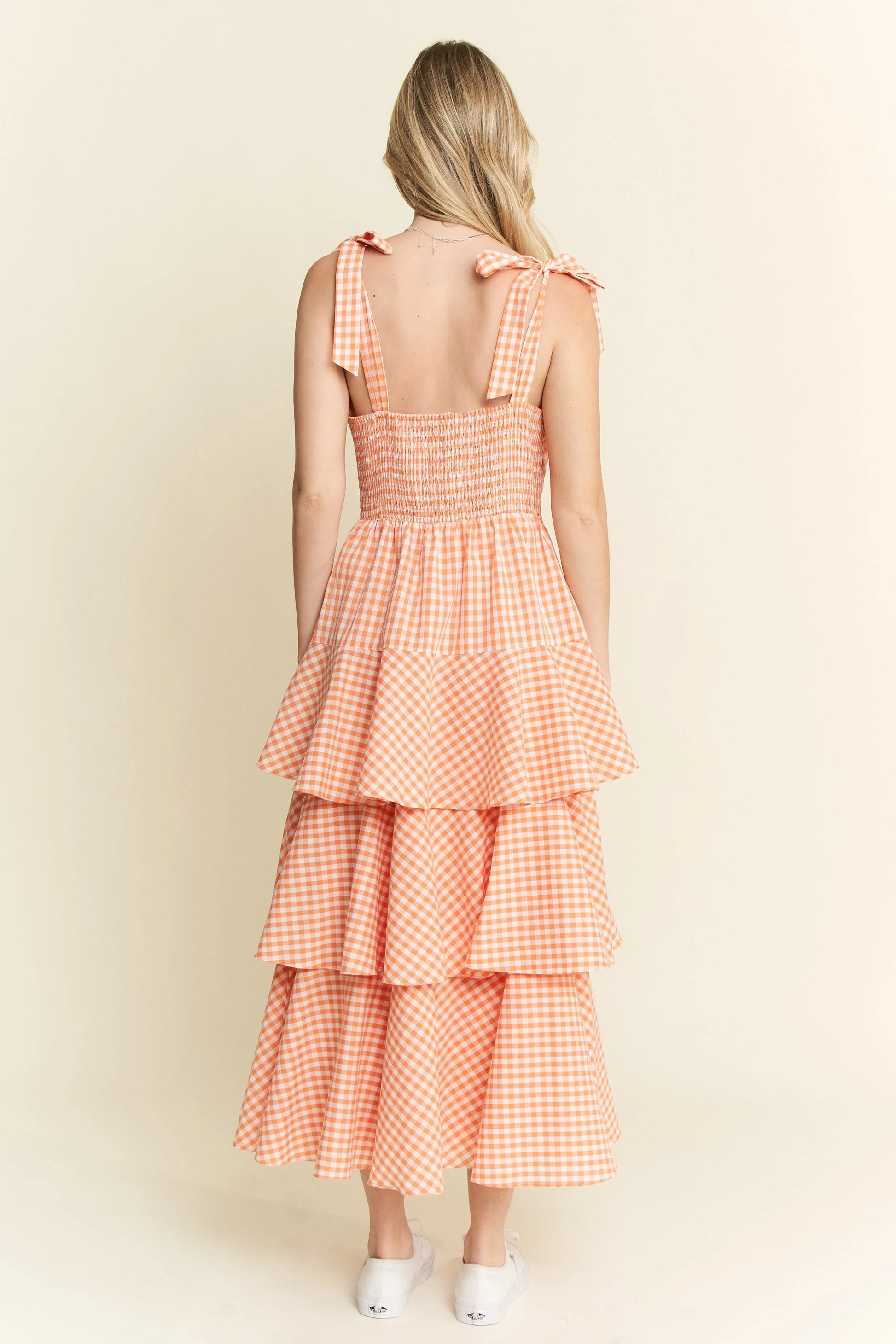 Back view of Alice Gingham Tiered Midi Dress by Jade by Jane, showcasing ruched back panel, halter tie straps, and tiered ruffle skirt design.
