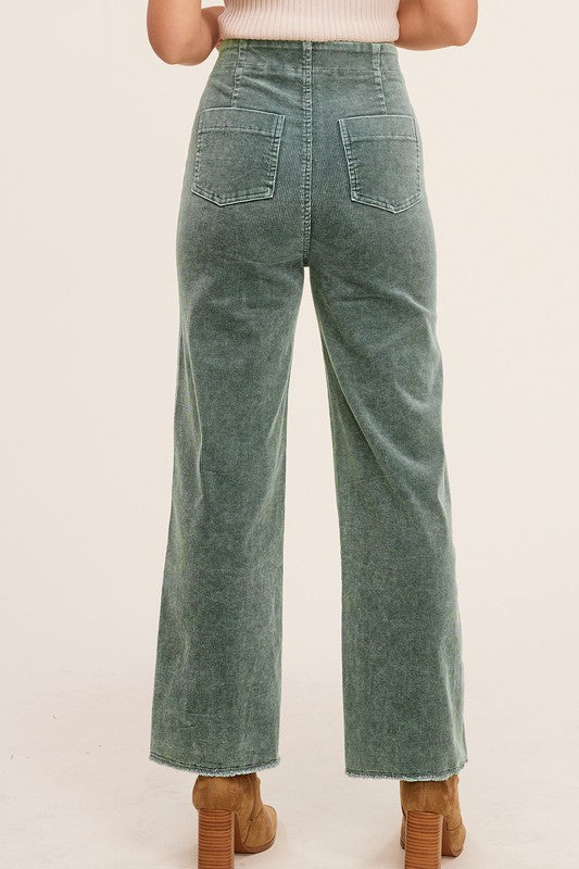 Teal mineral-washed corduroy wide-leg ankle-length jeans with raw-edge hem, front dart detail, zip fly, and back pockets.