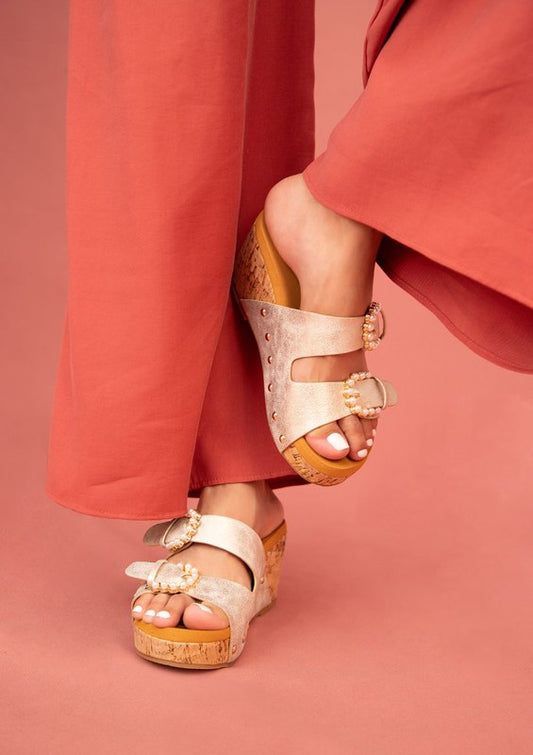 Gold Brianna Cork Wedge Sandal with open toe, cork heel, and adjustable closure.