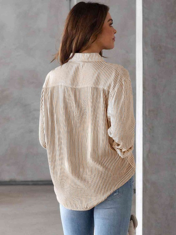 Sand striped shirt with a button-up collar and long sleeves.