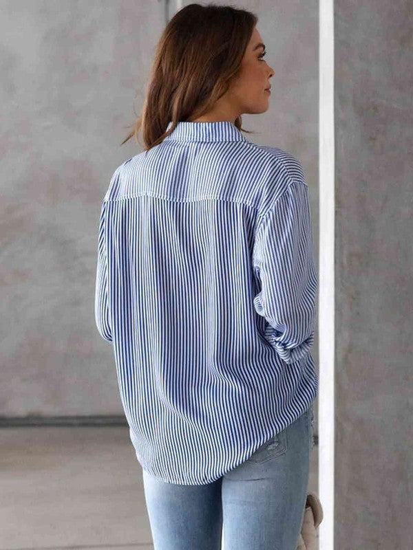 Misty Blue striped shirt with a button-up collar and long sleeves.