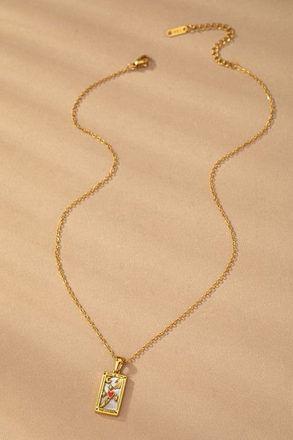Tarot Card Star Pendant Necklace with mother of pearl background and rhinestone details on gold-tone chain.