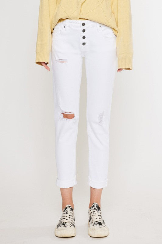 White, distressed, stretch girlfriend fit, ankle-length, jeans with a mid-rise waist and button fly closure.