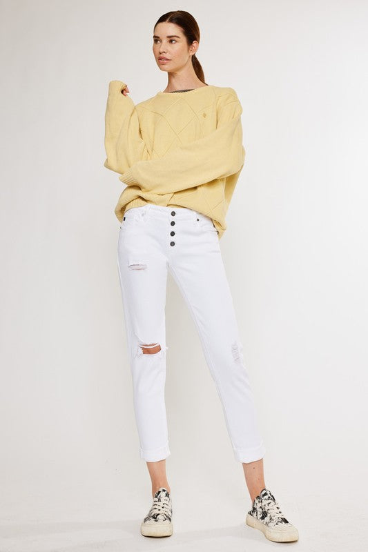 White, distressed, stretch girlfriend fit, ankle-length, jeans with a mid-rise waist and button fly closure.