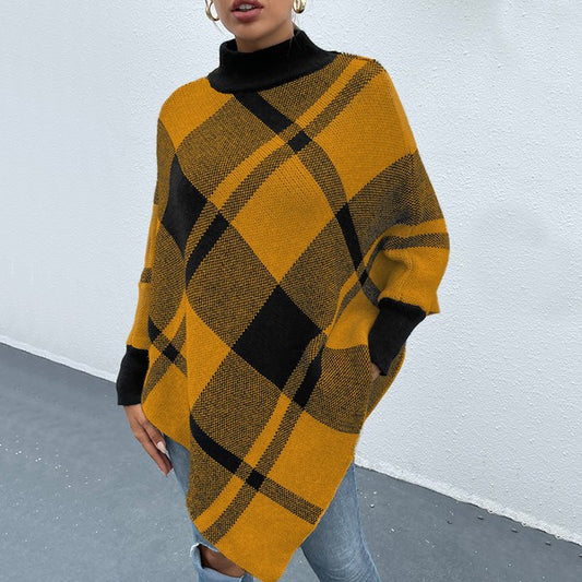 Woman modeling Murphie Plaid Knit Poncho, autumn-ready yellow-and-black plaid knit, long fit front angle