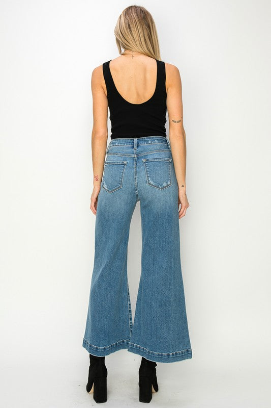 Medium stone wash high-rise crop palazzo jeans with wide hems and a slightly stretchy denim. 