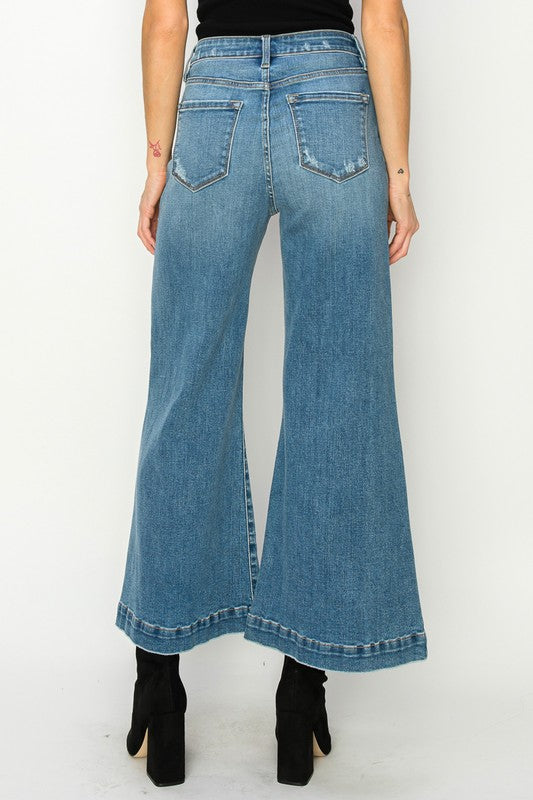 Medium stone wash high-rise crop palazzo jeans with wide hems and a slightly stretchy denim. 