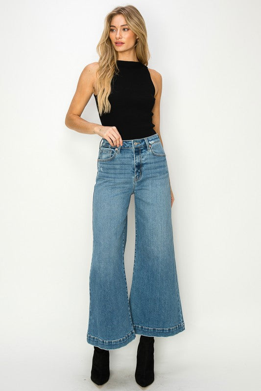 Medium stone wash high-rise crop palazzo jeans with wide hems and a slightly stretchy denim. 