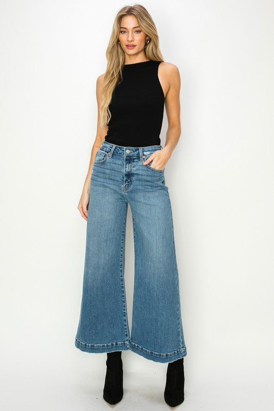 Medium stone wash high-rise crop palazzo jeans with wide hems and a slightly stretchy denim. 