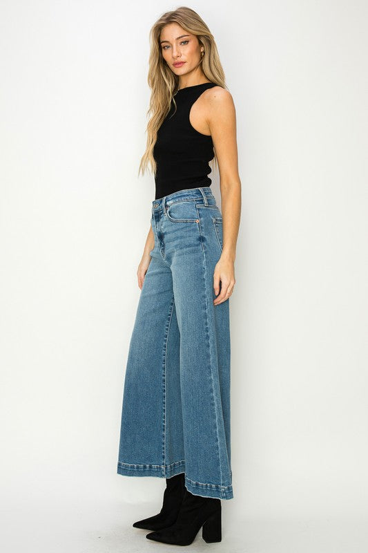 Medium stone wash high-rise crop palazzo jeans with wide hems and a slightly stretchy denim. 