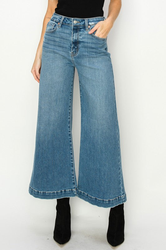 Medium stone wash high-rise crop palazzo jeans with wide hems and a slightly stretchy denim. 