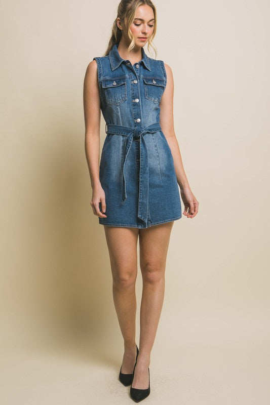 Strapless denim dress with a waist tie, a fitted silhouette, sleeveless design, and pocket detailing.