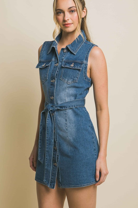 Strapless denim dress with a waist tie, a fitted silhouette, sleeveless design, and pocket detailing.