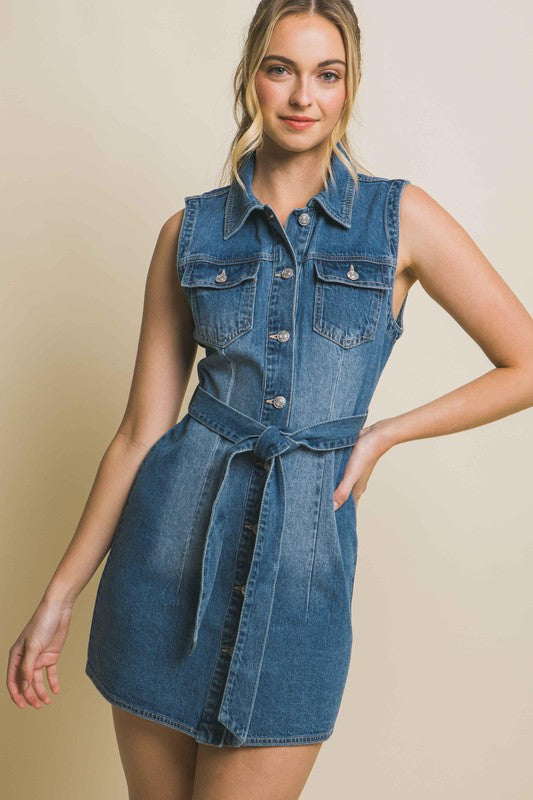 Strapless denim dress with a waist tie, a fitted silhouette, sleeveless design, and pocket detailing.