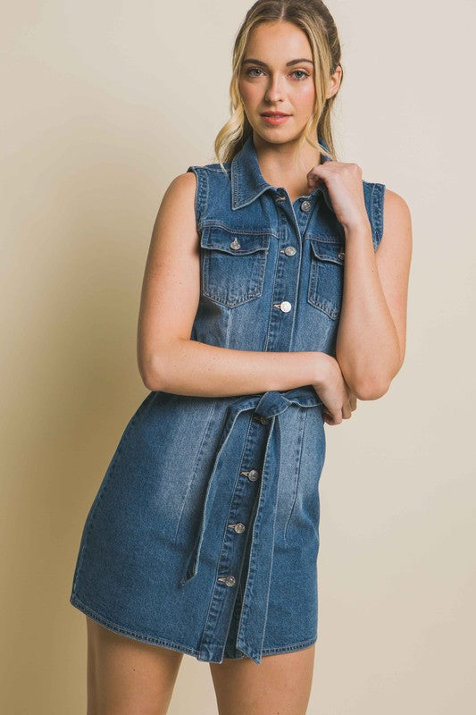 Strapless denim dress with a waist tie, a fitted silhouette, sleeveless design, and pocket detailing.