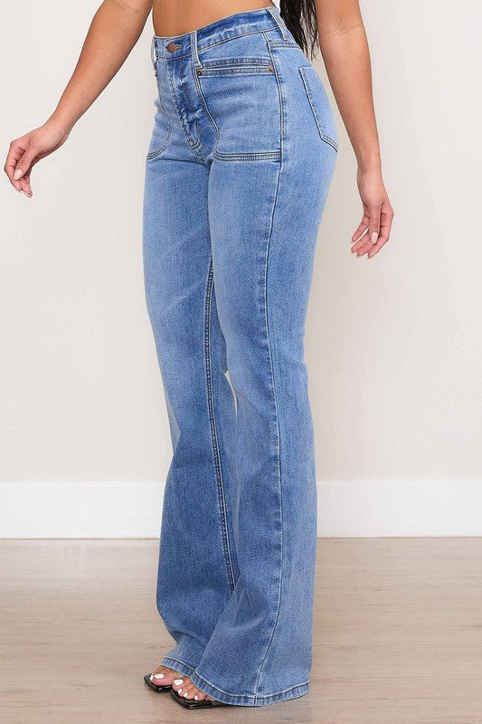 Vibrant M.i.U Kayla Square Pocket Bootcut Jeans in medium stone wash, featuring a high rise, zip fly, and large square front pockets for a modern touch.