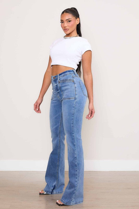 Vibrant M.i.U Kayla Square Pocket Bootcut Jeans in medium stone wash, featuring a high rise, zip fly, and large square front pockets for a modern touch.