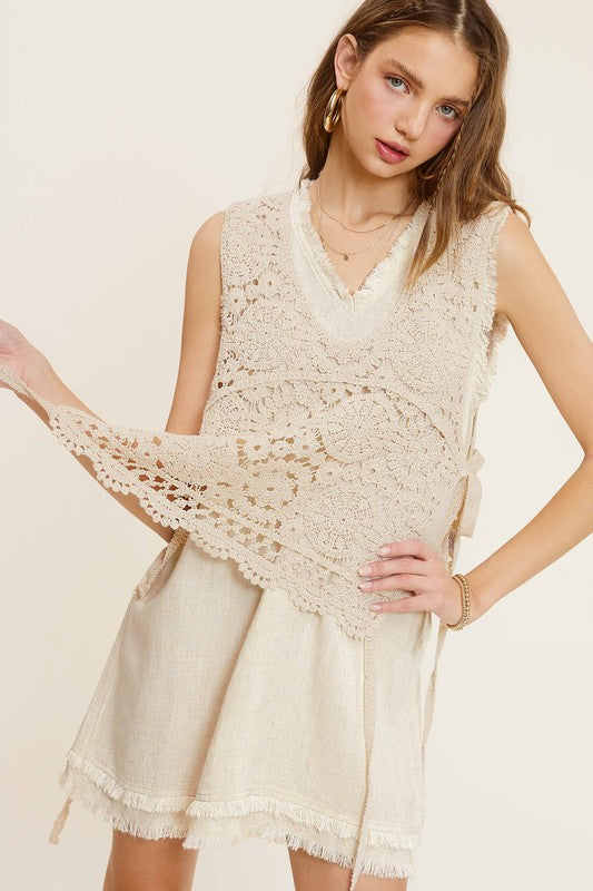 Sleeveless crochet vest with scoop neckline and side self-tie details.