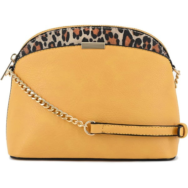 Mustard Leopard Accent Crossbody Bag with leopard piping, gold chain detail, zipper closure, and dome silhouette.