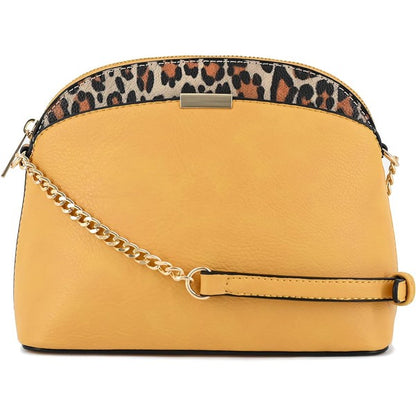 Mustard Leopard Accent Crossbody Bag with leopard piping, gold chain detail, zipper closure, and dome silhouette.