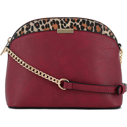 Wine Leopard Accent Crossbody Bag with leopard trim, gold chain strap, secure zipper, and compact design.
