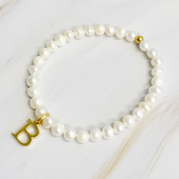 Freshwater Pearl Initial Charm Bracelet featuring genuine freshwater pearls and a gold-plated letter B initial charm, approximately 6.5" before stretch.