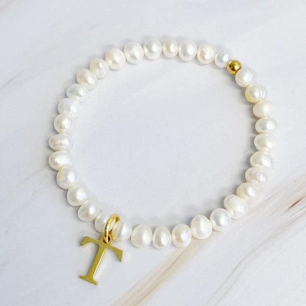 Freshwater Pearl Initial Charm Bracelet featuring genuine freshwater pearls and a gold-plated letter T initial charm, approximately 6.5" before stretch.