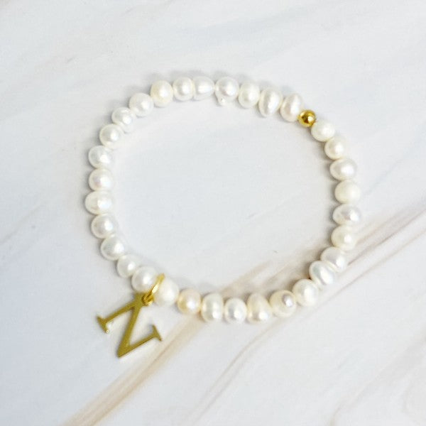 Freshwater Pearl Initial Charm Bracelet featuring genuine freshwater pearls and a gold-plated letter N initial charm, approximately 6.5" before stretch.