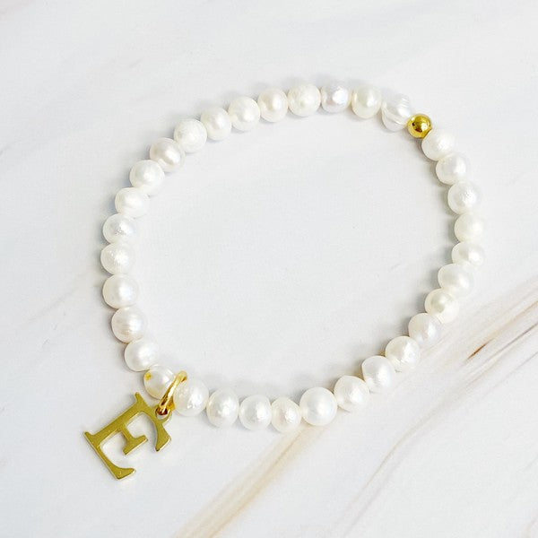 Freshwater Pearl Initial Charm Bracelet featuring genuine freshwater pearls and a gold-plated letter E initial charm, approximately 6.5" before stretch.