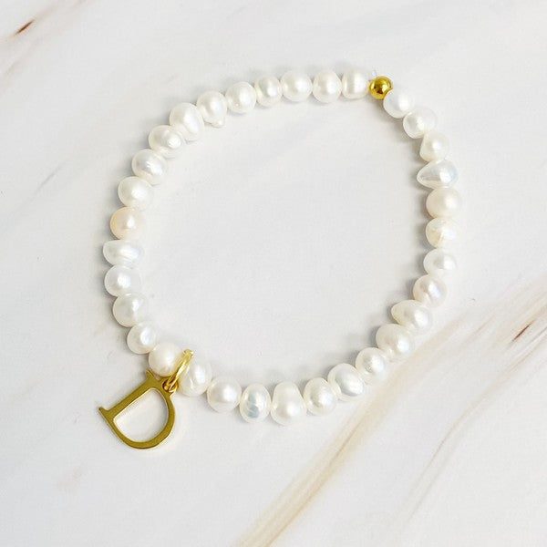 Freshwater Pearl Initial Charm Bracelet featuring genuine freshwater pearls and a gold-plated letter D initial charm, approximately 6.5" before stretch.