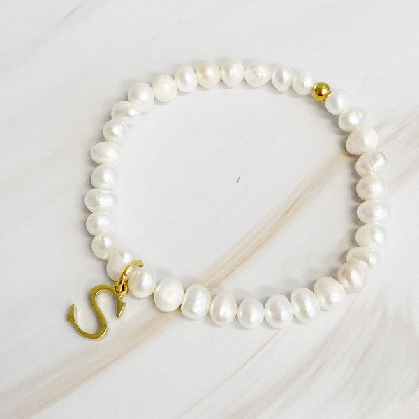 Freshwater Pearl Initial Charm Bracelet featuring genuine freshwater pearls and a gold-plated letter S initial charm, approximately 6.5" before stretch.