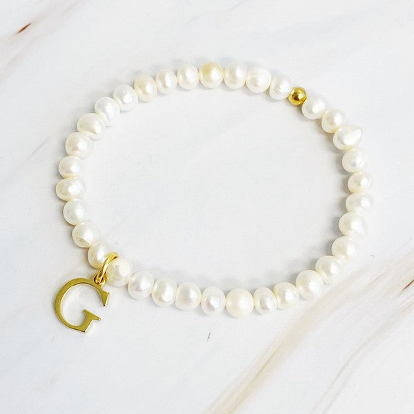 Freshwater Pearl Initial Charm Bracelet featuring genuine freshwater pearls and a gold-plated letter G initial charm, approximately 6.5" before stretch.