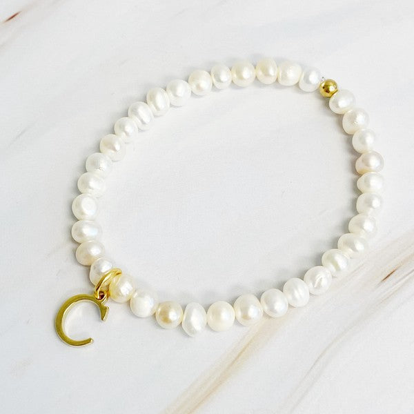 Freshwater Pearl Initial Charm Bracelet featuring genuine freshwater pearls and a gold-plated letter C initial charm, approximately 6.5" before stretch.