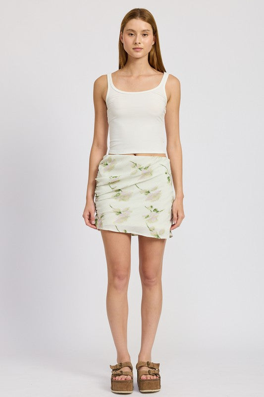 Ivory floral pencil skirt with side slit, mid-rise waist, and mini length. Chic and versatile for casual to evening wear.