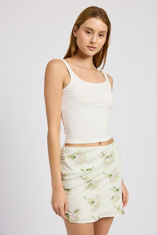 Ivory floral pencil skirt with side slit, mid-rise waist, and mini length. Chic and versatile for casual to evening wear.