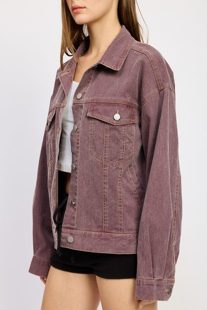 A sleek side view highlighting the oversized fit, classic collar, and structured denim design, perfect for layering over any outfit.