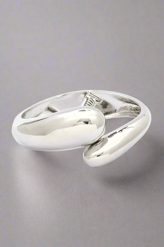 Polished Organic Hinged Bangle in silver, front view showing sculptural organic design.