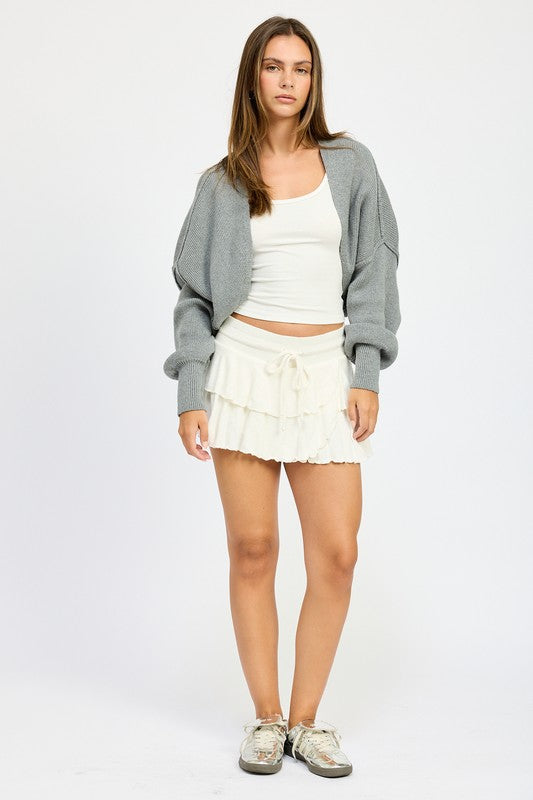 Full body look of Jericha Shrug Cardigan in gray layered over white tank