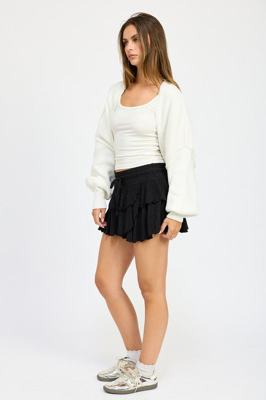 Side view of Jericha Shrug Cardigan in off white with relaxed fit