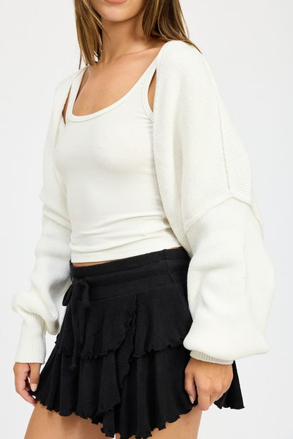 Close up of Jericha Shrug Cardigan in off white showing wide sleeves