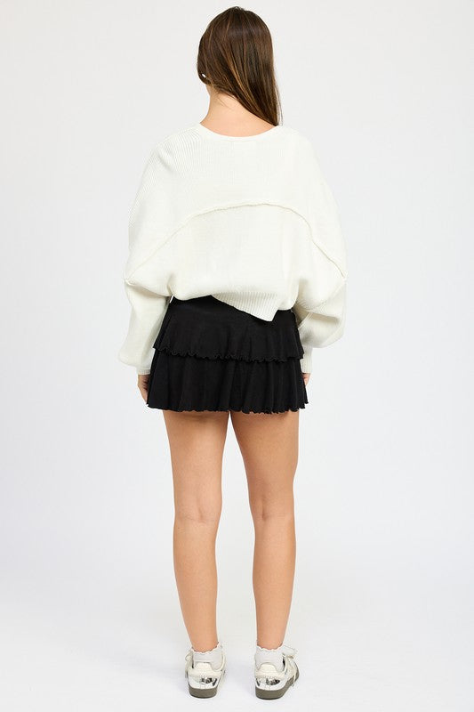 Back view of Jericha Shrug Cardigan in off white showing oversized style