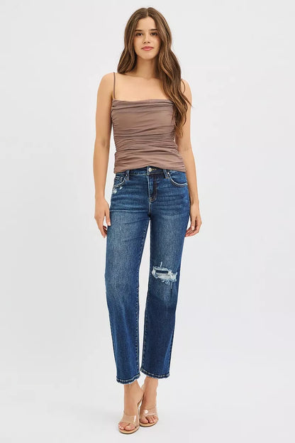 Model wearing Jenna High Rise Crop Slim Straight Jeans.