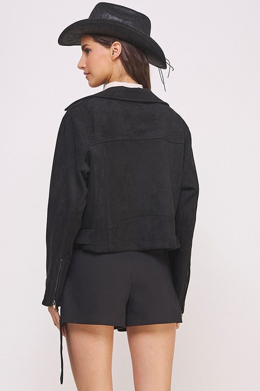 Black belted long sleeve zippered suede moto jacket with front zippers, snap details, and two zipper pockets.