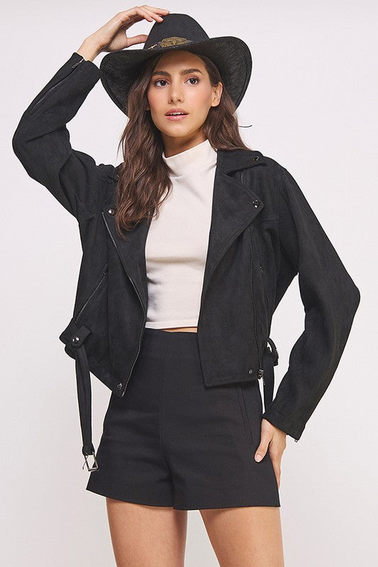 Black belted long sleeve zippered suede moto jacket with front zippers, snap details, and two zipper pockets.