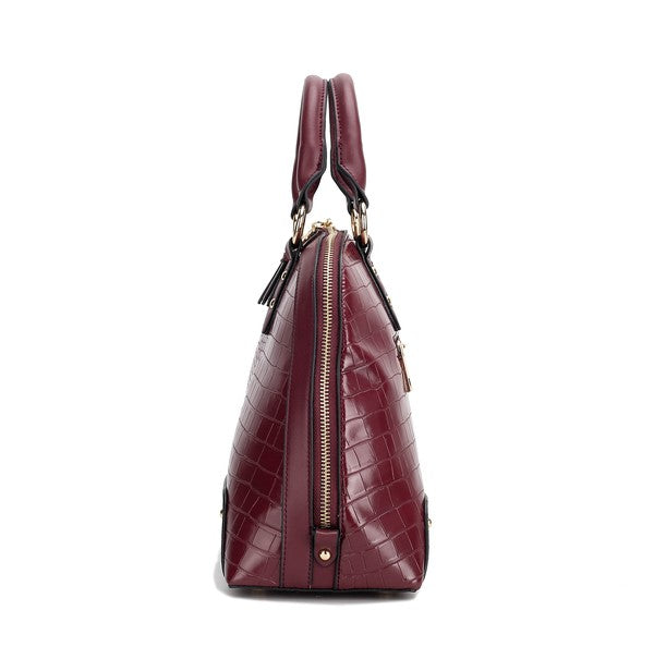 Side view of Eggplant Nora Satchel showing structured silhouette and top handles.